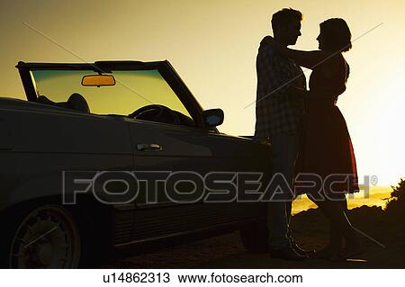 Silhouette of couple hugging View Large Photo Image Stock Image - Silhouette of couple hugging. Fotosearch