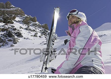 Skier resting on mountainside View Large Photo Image Stock Photo - Skier resting on mountainside. Fotosearch