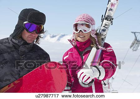 Skiers carrying equipment outdoors View Large Photo Image Stock Photo - Skiers carrying equipment outdoors. Fotosearch