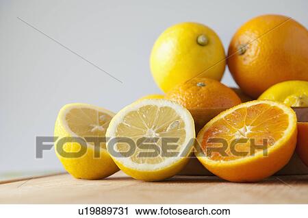 Stock Image - Sliced oranges and lemons. Fotosearch