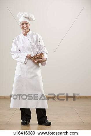 Smiling chef holding mixing bowl View Large Photo Image Stock Photo - Smiling chef holding mixing bowl. Fotosearch