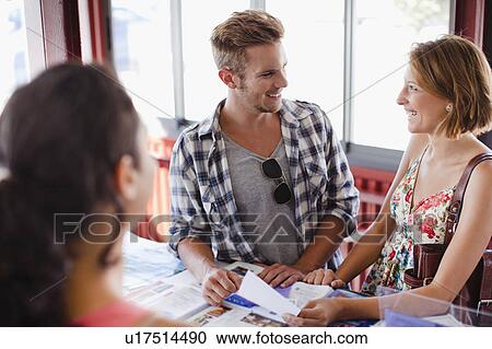 Smiling couple at tourist info center View Large Photo Image Stock Image - Smiling couple at tourist info center. Fotosearch
