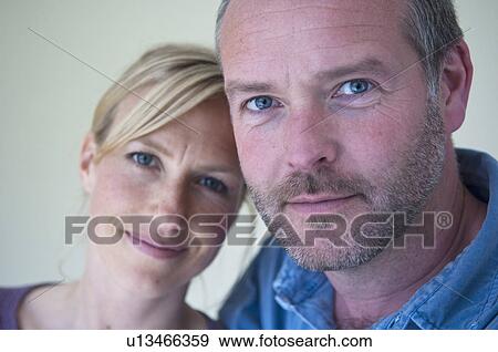 Stock Photo - Smiling couple hugging. Fotosearch