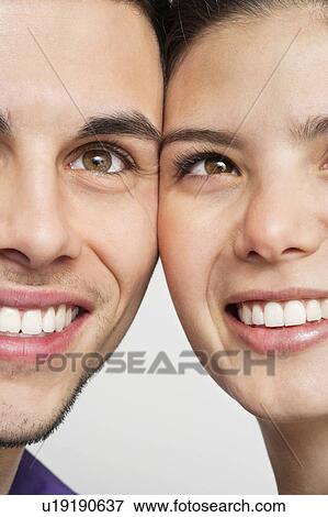 Smiling couple standing together View Large Photo Image Stock Photo - Smiling couple standing together. Fotosearch