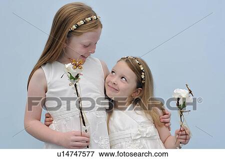 Stock Photo - Smiling flower girls in wedding. Fotosearch