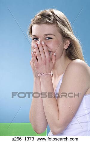 Stock Image - Smiling girl laughing. Fotosearch