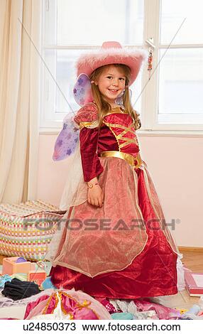 Smiling girl playing dress up View Large Photo Image Stock Image - Smiling girl playing dress up. Fotosearch