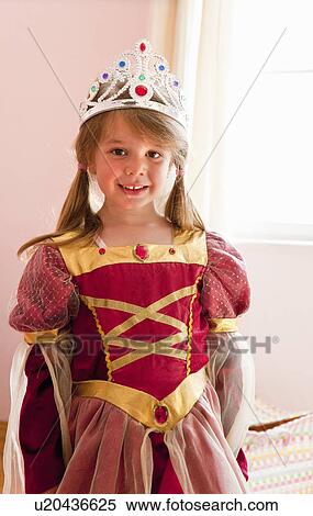 Smiling girl playing dress up View Large Photo Image Stock Photography - Smiling girl playing dress up. Fotosearch