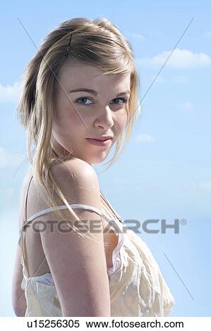 Smiling girl shrugging View Large Photo Image Stock Photography - Smiling girl shrugging. Fotosearch