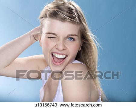 Stock Photo - Smiling girl winking. Fotosearch