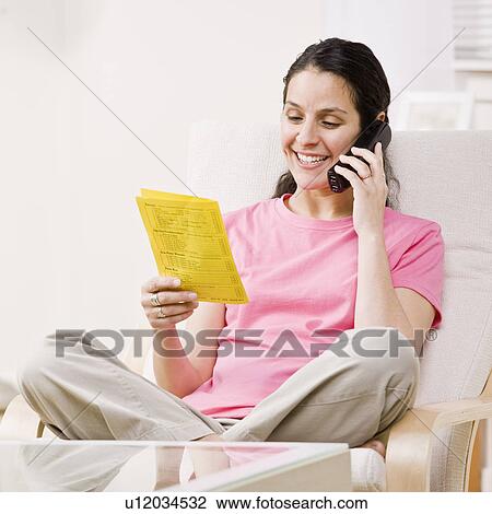 Smiling woman ordering take-out food View Large Photo Image Stock Image - Smiling woman ordering take-out food . Fotosearch