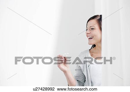 Smiling woman taking pregnancy test View Large Photo Image Stock Image - Smiling woman taking pregnancy test. Fotosearch