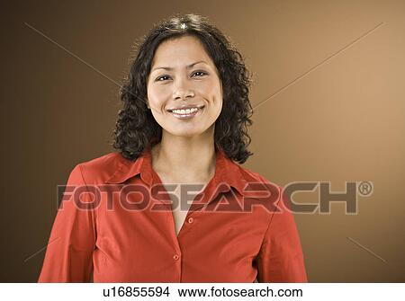 Picture - Smiling woman wearing red blouse. Fotosearch