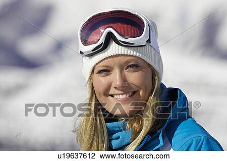 Smiling woman wearing ski goggles View Large Photo Image Stock Image - Smiling woman wearing ski goggles. Fotosearch