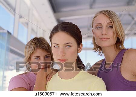 Smiling women standing together View Large Photo Image Stock Image - Smiling women standing together. Fotosearch