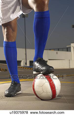 Soccer player with ball on rooftop View Large Photo Image Stock Photo - Soccer player with ball on rooftop. Fotosearch