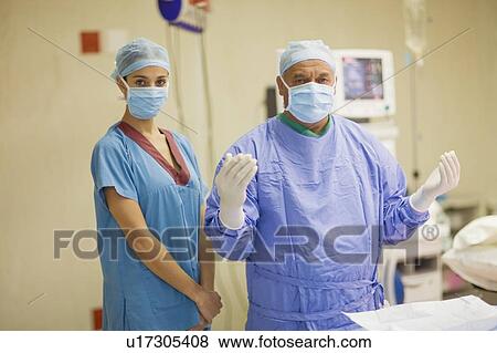 Stock Photo - Surgeon and nurse in operating room. Fotosearch