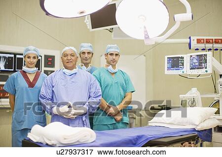 Surgeon and nurses in operating room View Large Photo Image Stock Photo - Surgeon and nurses in operating room. Fotosearch