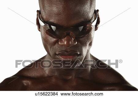 Sweaty athlete wearing sunglasses View Large Photo Image Picture - Sweaty athlete wearing sunglasses. Fotosearch