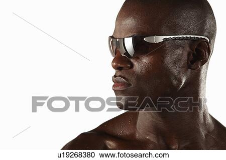 Sweaty athlete wearing sunglasses View Large Photo Image Stock Image - Sweaty athlete wearing sunglasses. Fotosearch