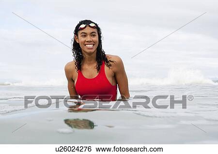 Swimmer wearing goggles in water View Large Photo Image Stock Photograph - Swimmer wearing goggles in water. Fotosearch
