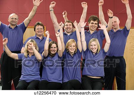 Team of trainers cheering at gym View Large Photo Image Stock Image - Team of trainers cheering at gym. Fotosearch