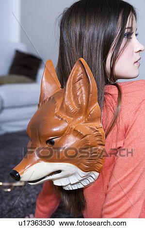 Teenage girl with fox mask View Large Photo Image Stock Image - Teenage girl with fox mask. Fotosearch