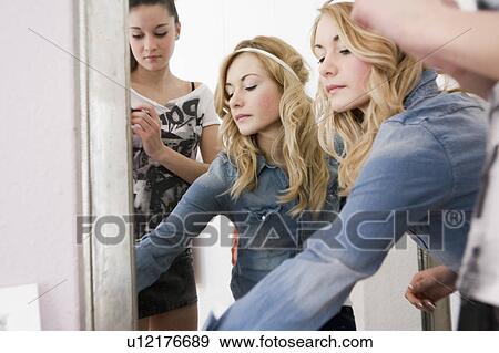 Teenage girls getting dressed up View Large Photo Image Stock Photo - Teenage girls getting dressed up. Fotosearch
