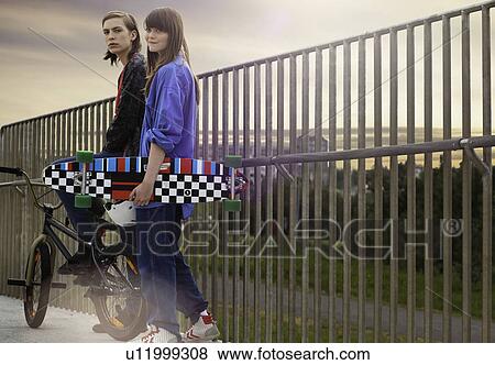 Teenagers walking on walkway View Large Photo Image Stock Photo - Teenagers walking on walkway. Fotosearch