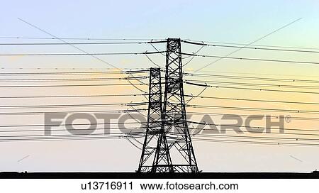 Stock Image - Telephone lines against blue sky. Fotosearch