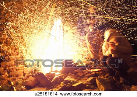 Picture - Time lapse view of sparks of campfire. Fotosearch