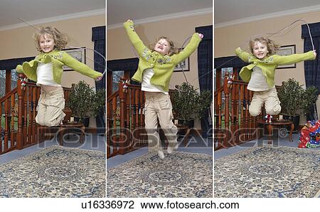 Stock Image - Triptych of girl jumping in house. Fotosearch