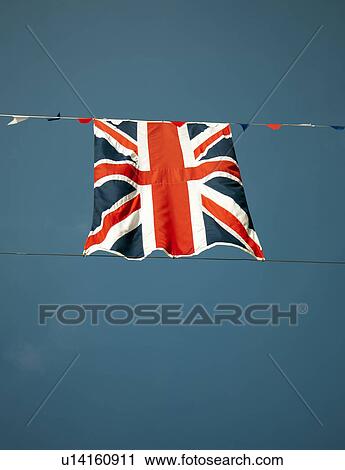Union Jack flag against blue sky View Large Photo Image Stock Image - Union Jack flag against blue sky. Fotosearch