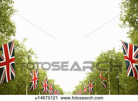Stock Image - Union Jack flags hanging in park. Fotosearch