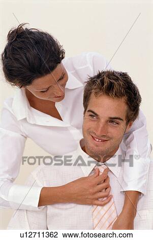 Woman adjusting boyfriend’s tie View Large Photo Image Stock Image - Woman adjusting boyfriend’s tie. Fotosearch