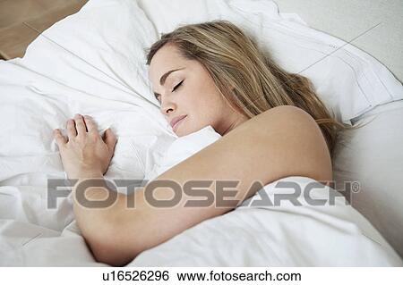 Woman asleep in bed View Large Photo Image Stock Photograph - Woman asleep in bed. Fotosearch