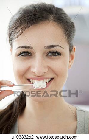 Woman brushing her teeth View Large Photo Image Stock Image - Woman brushing her teeth. Fotosearch