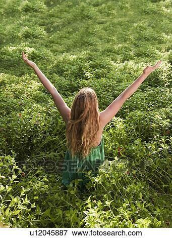 Woman cheering in forest View Large Photo Image Stock Photo - Woman cheering in forest. Fotosearch