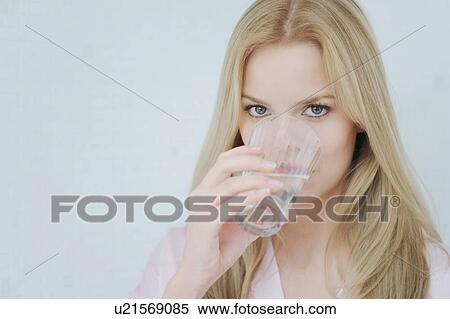 Stock Photography - Woman drinking glass of water. Fotosearch