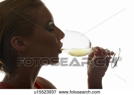 Stock Photo - Woman drinking glass of wine. Fotosearch