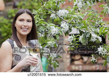 Woman drinking wine outdoors View Large Photo Image Stock Photography - Woman drinking wine outdoors. Fotosearch