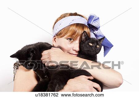 Woman embracing her cats View Large Photo Image Stock Image - Woman embracing her cats. Fotosearch
