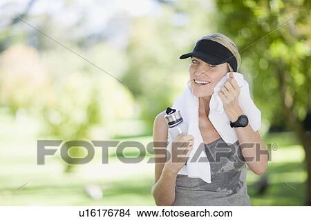 Picture - Woman exercising outdoors. Fotosearch