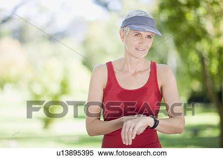 Woman exercising outdoors View Large Photo Image Stock Photography - Woman exercising outdoors. Fotosearch