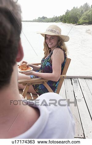 Woman having breakfast on deck View Large Photo Image Stock Image - Woman having breakfast on deck. Fotosearch