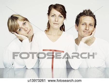 Woman holding friends faces View Large Photo Image Stock Image - Woman holding friends faces. Fotosearch