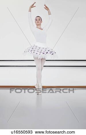 Stock Image - Woman in ballet costume dancing. Fotosearch