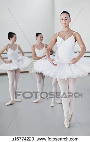 Stock Image - Woman in ballet costume dancing. Fotosearch