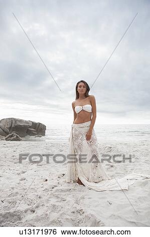 Woman in bikini and skirt on beach View Large Photo Image Stock Photograph - Woman in bikini and skirt on beach. Fotosearch