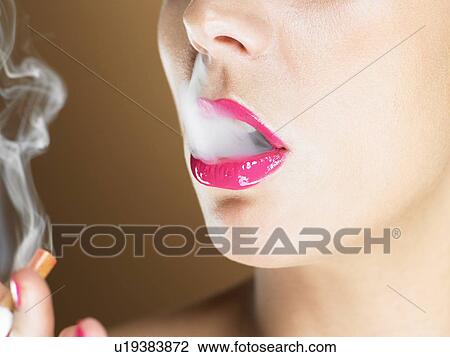 Woman in pink lipstick smoking View Large Photo Image Stock Image - Woman in pink lipstick smoking. Fotosearch